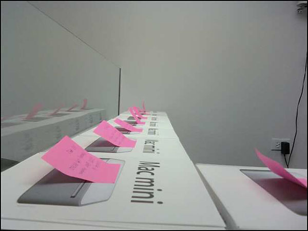 Mac Minis labeled with Post-Its